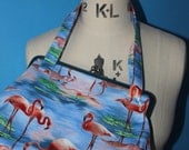 flamingo kiss lock handbag.