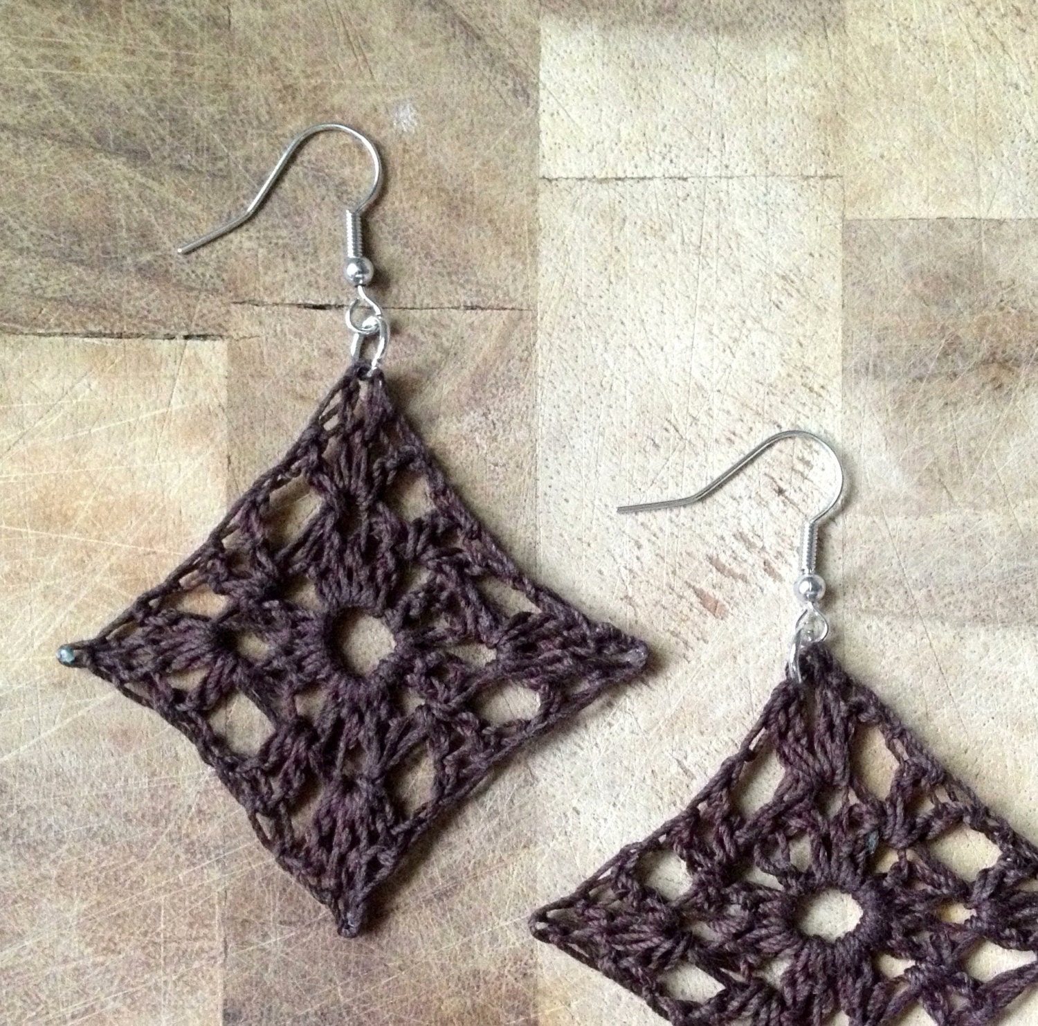 small lacy crochet granny square earrings . brown .