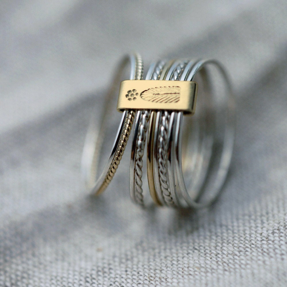 9 twist and turn silver with 18kt yellow gold stacking rings