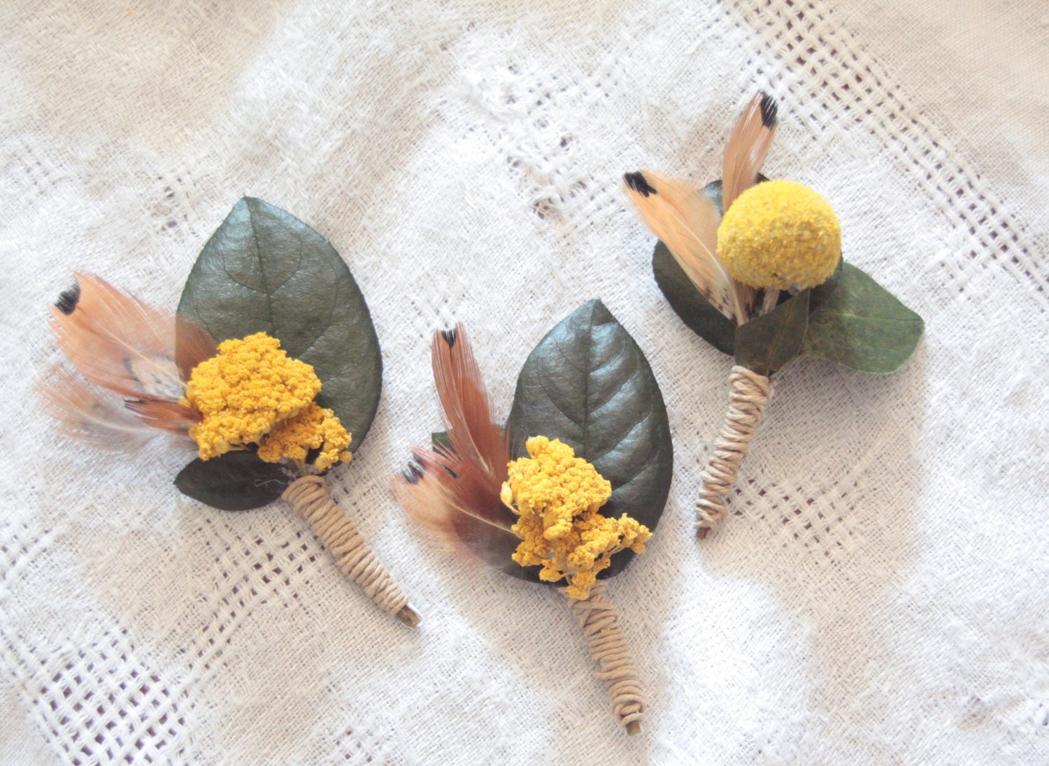 Mustard Gold Boutonnieres with Feathers and a real leaf