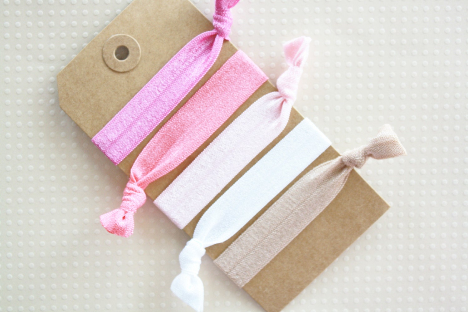 elastic hair ties... plum, coral, pink, white and beige