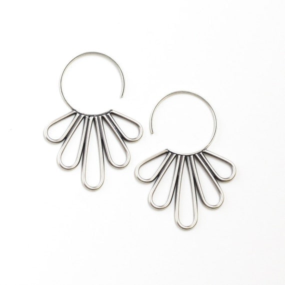 Elegant silver earrings with feather shapes soldered together to a hoop to make a modern piece of jewelry - "Peacock Hoop Earrings"