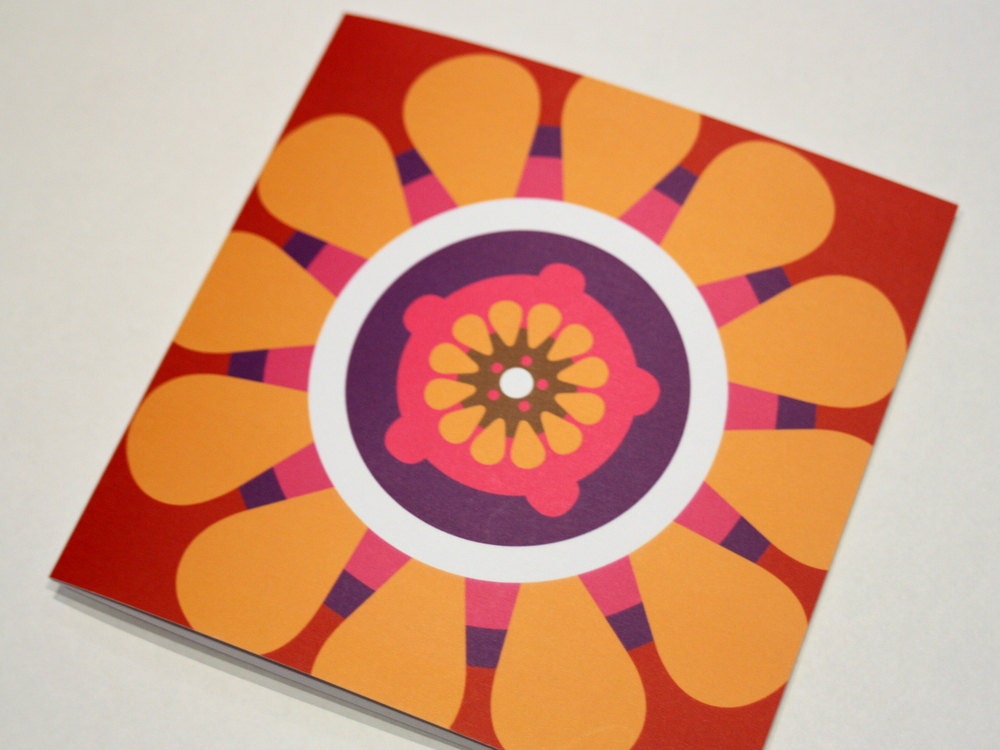 Bright spicy orange and red folded square card with a bold gerbera daisy design in citrus summer colours, contemporary Irish design
