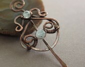 Shawl pin or scarf pin in sculptured swirly lotus design with pale blue aquamarine stones