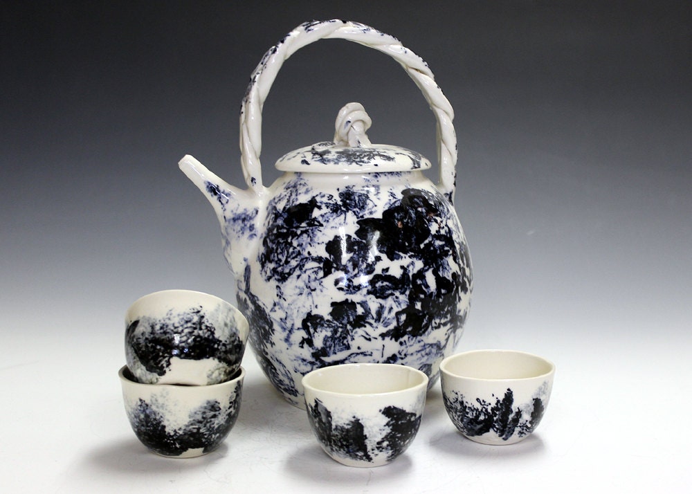 Ceramic and pottery tea set with four matching tea bowls
