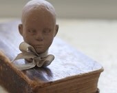 tiny clay head