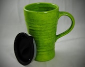 Bright Green Ceramic Travel Mug with a lid.
