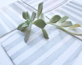 Foggy gray and white stoneware coasters. Four, striped, modern.