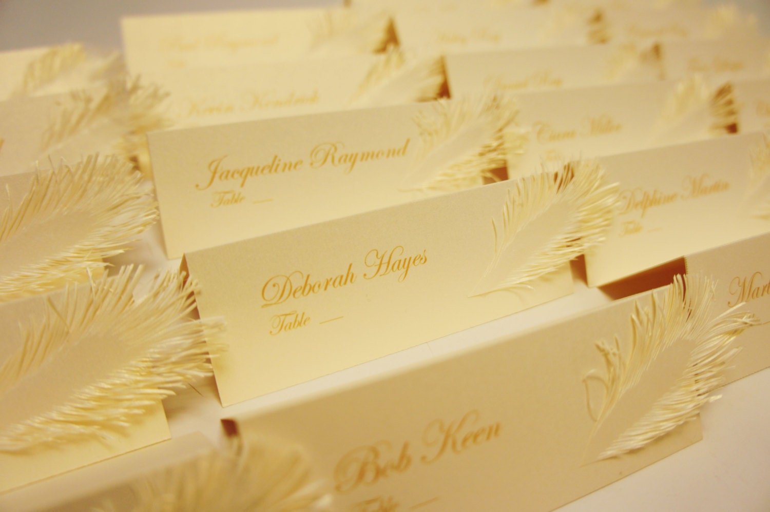 Ivory to Gold place card with feather handmade of paper