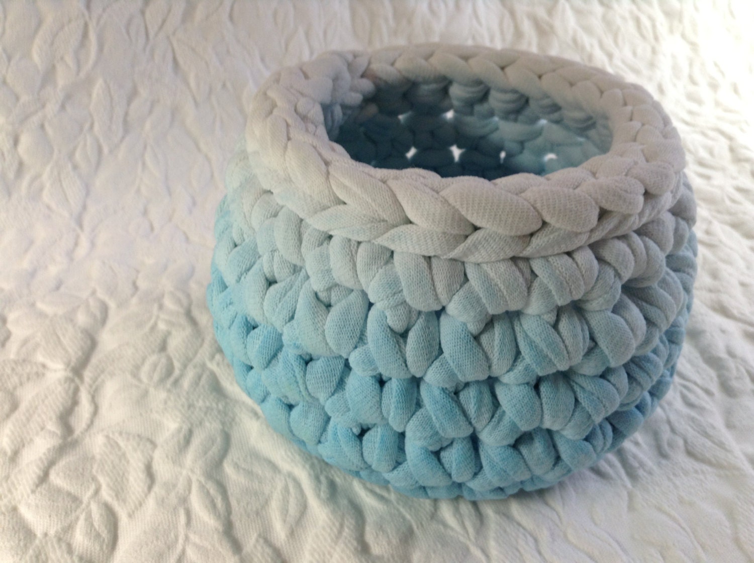 Light blue and white crocheted basket created from recycled t shirts