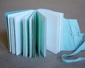 Blue suede book with letterpress printed pages