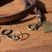 multi wrap dark brown togo flat leather bracelet with brass leaf connector and bird