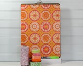 Papered Clipboard.  Letter size, Orange Medallion