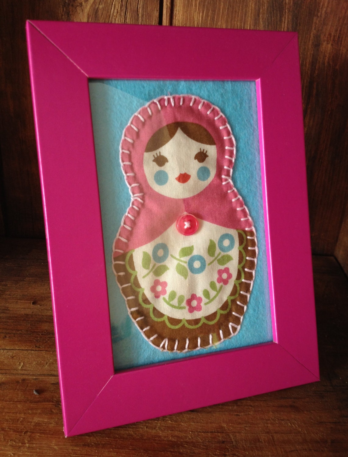 Pink Matryoshka doll in a bright pink frame