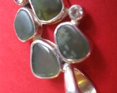 One of a kind. Big Sur Jade set with Diamond and tourmaline.