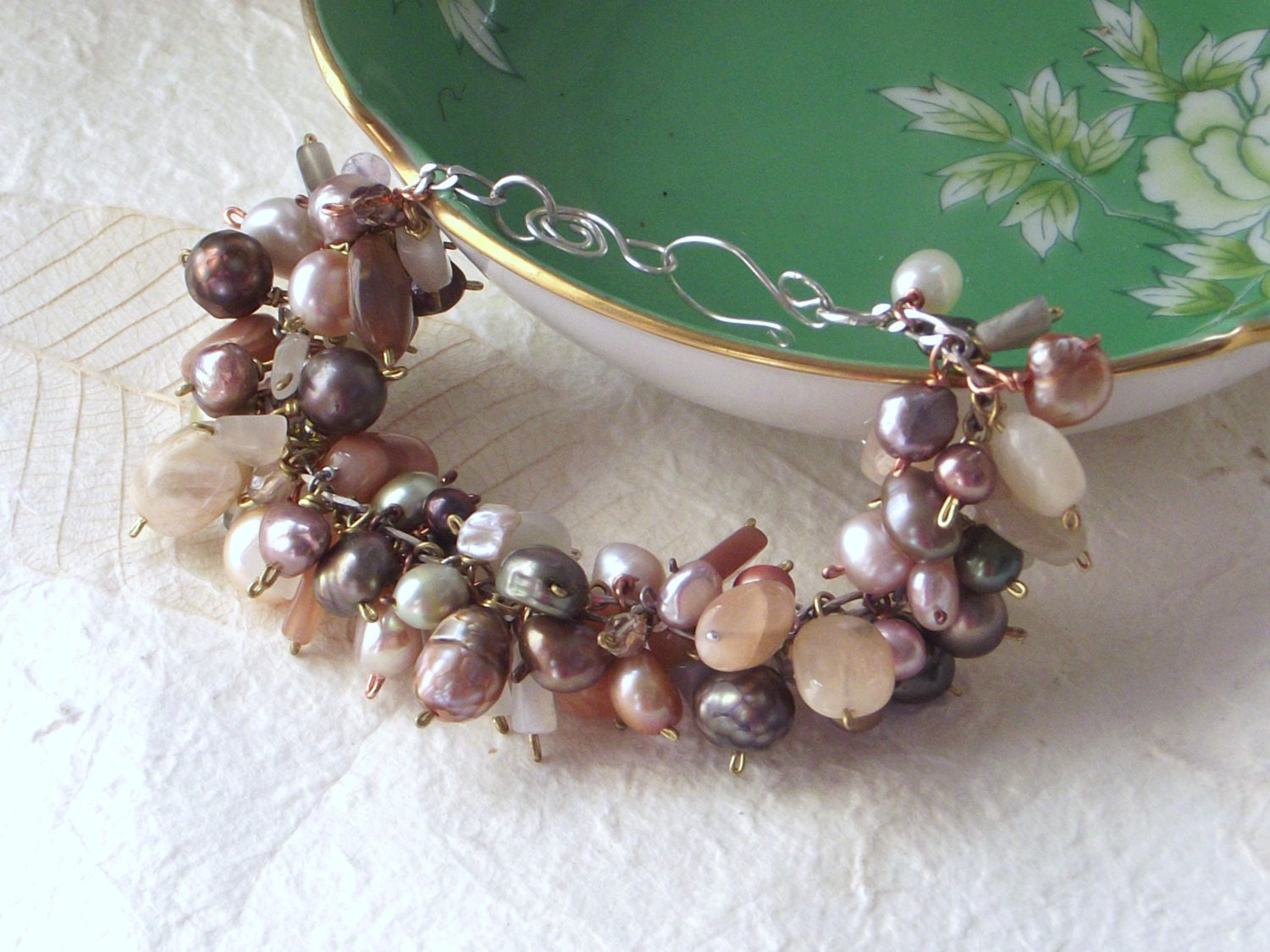Charm bracelet with moonstone, freshwater pearl and glass with handmade sterling silver clasp.