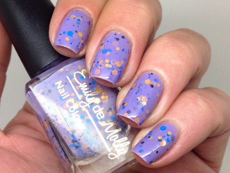 Nail polish - "Regal Beginnings" gold, blue and black glitter in a purple base