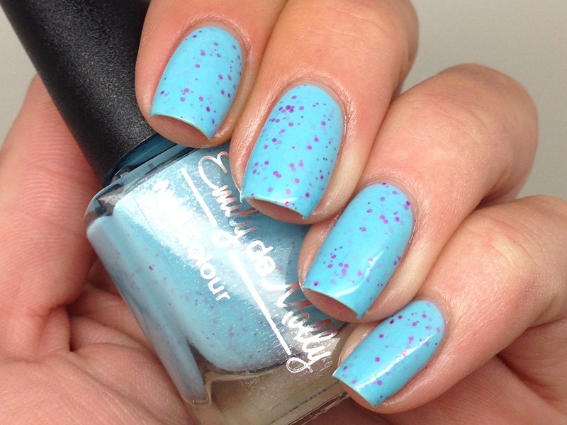 Nail polish - "Candy Coated" pink glitter in a bright blue base