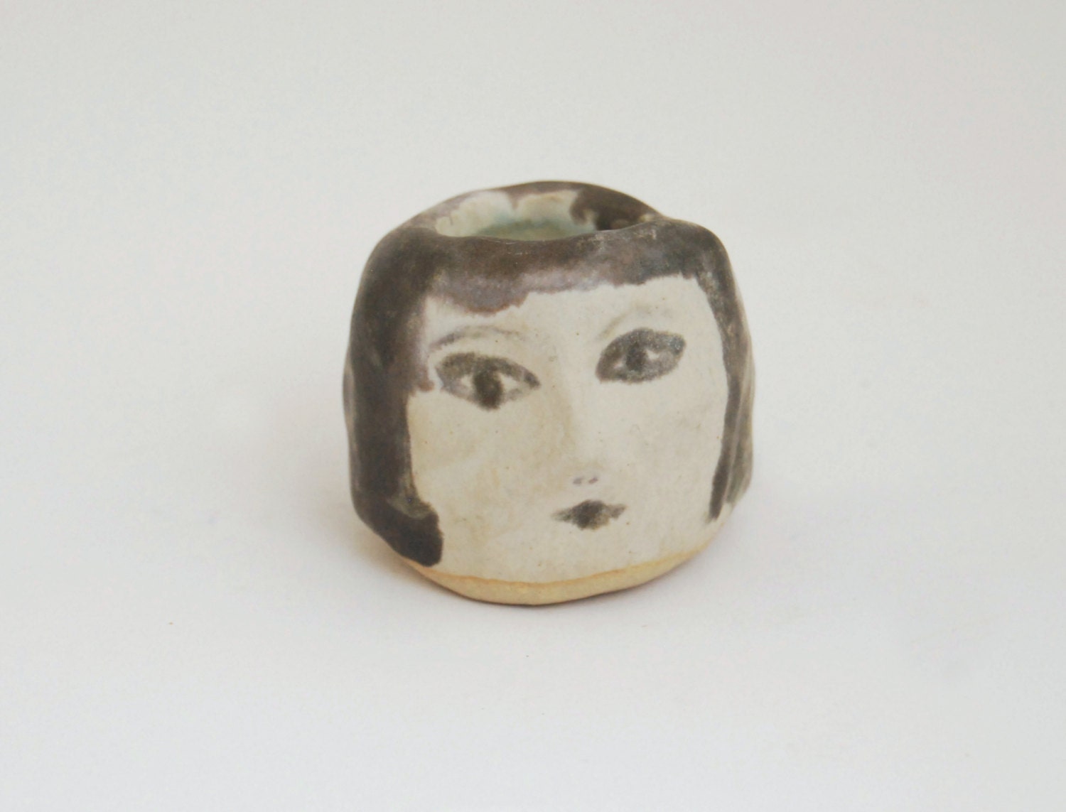 Girl's head ceramic candle holder in black, white and turqoise