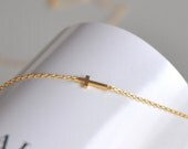 Gold Sideways Tiny Cross Bracelet