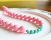 Pink and teal statement necklace color block