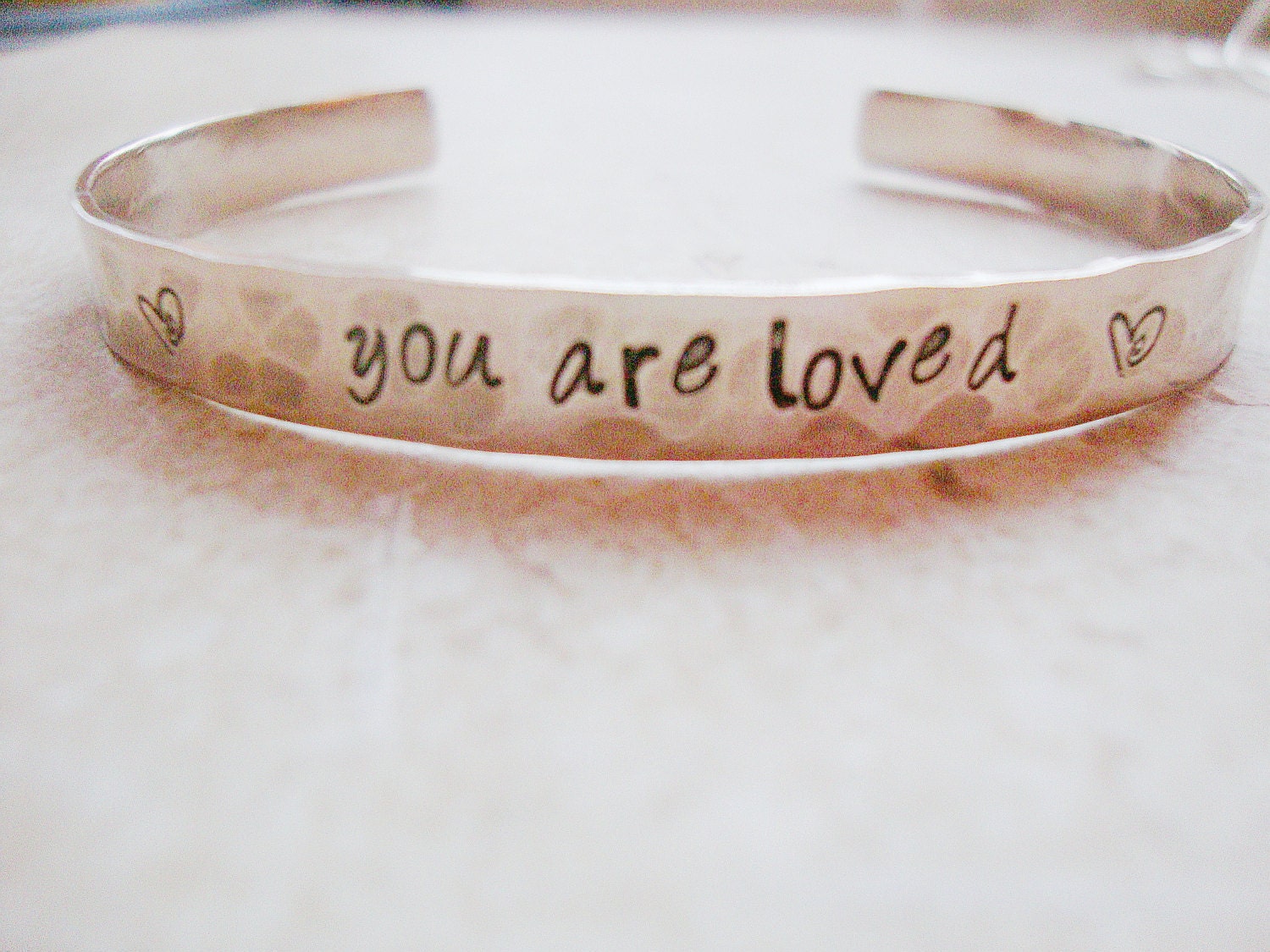 You are loved hand stamped silver hammered cuff message of love reminder
