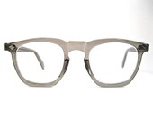 gray plastic horn rimmed mens/unisex safety glasses. large. clear/translucent plastic. USS 46-22.