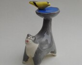 handmade ceramic gray and white cat with birdbath-shaped tail, miniature sculpture