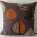 Retro autumn leaves in orange and beige over brown background cushion cover, slip cover, decorative cushion