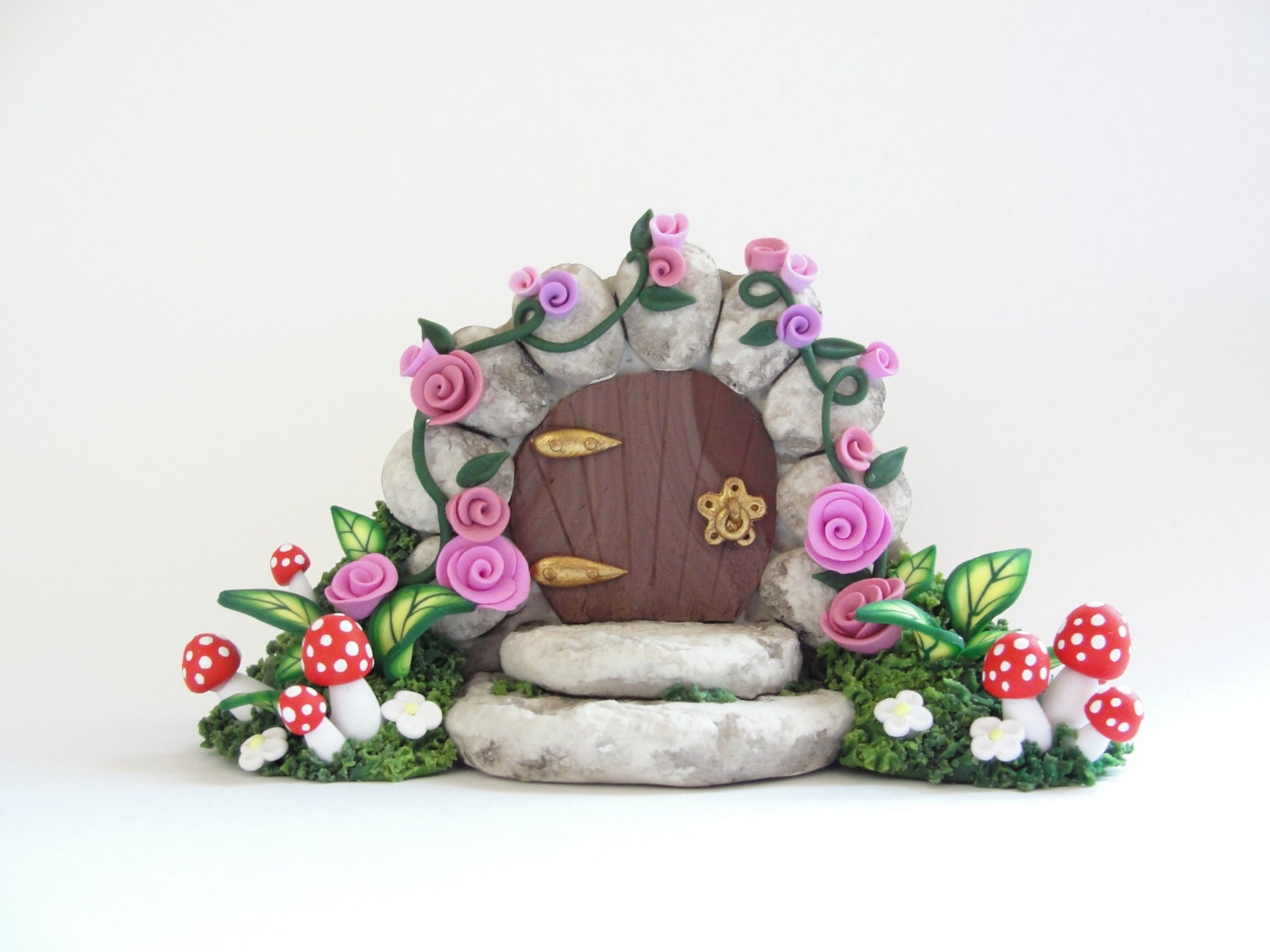 Miniature fairy gate door covered in pink roses for 1/4 scale dollhouse made from polymer clay