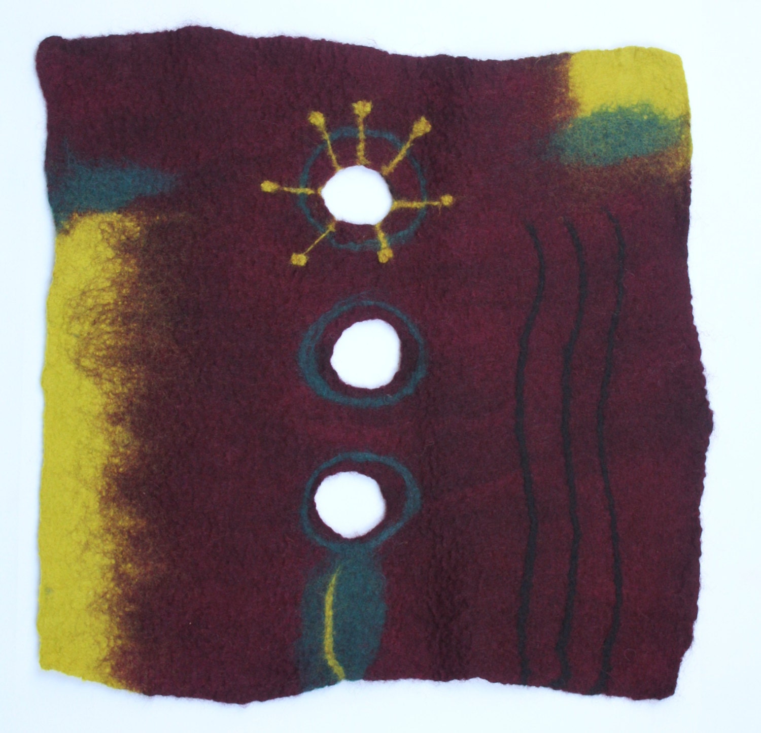 Deep red wool felt wall art with holes