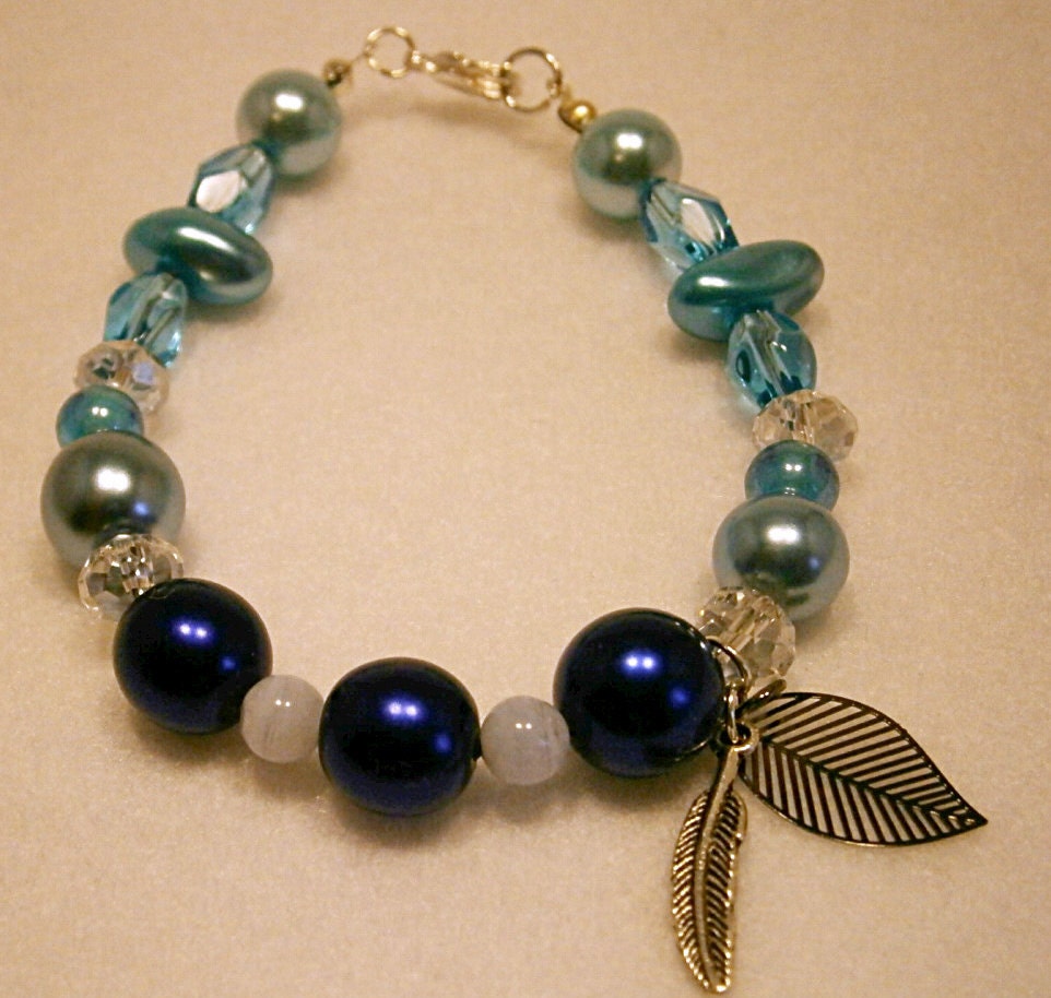 Handmade Blue Goddess Glass Beaded Bracelet with Ethereal Mother Earth Leaf, Blue Lace Agate gemstones and Silver coloured Angel Feather