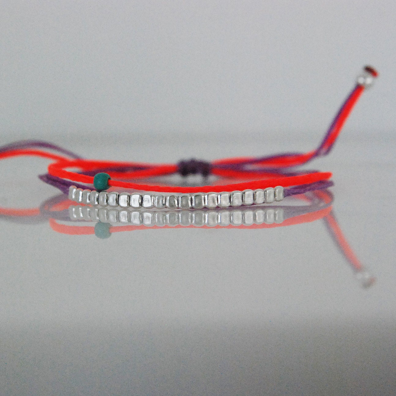 Layered dainty bracelet with hammered silver beads