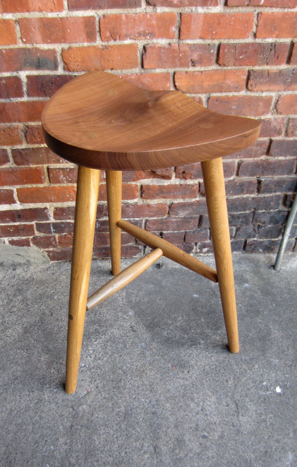 Stool made in sustainably sourced black walnut.