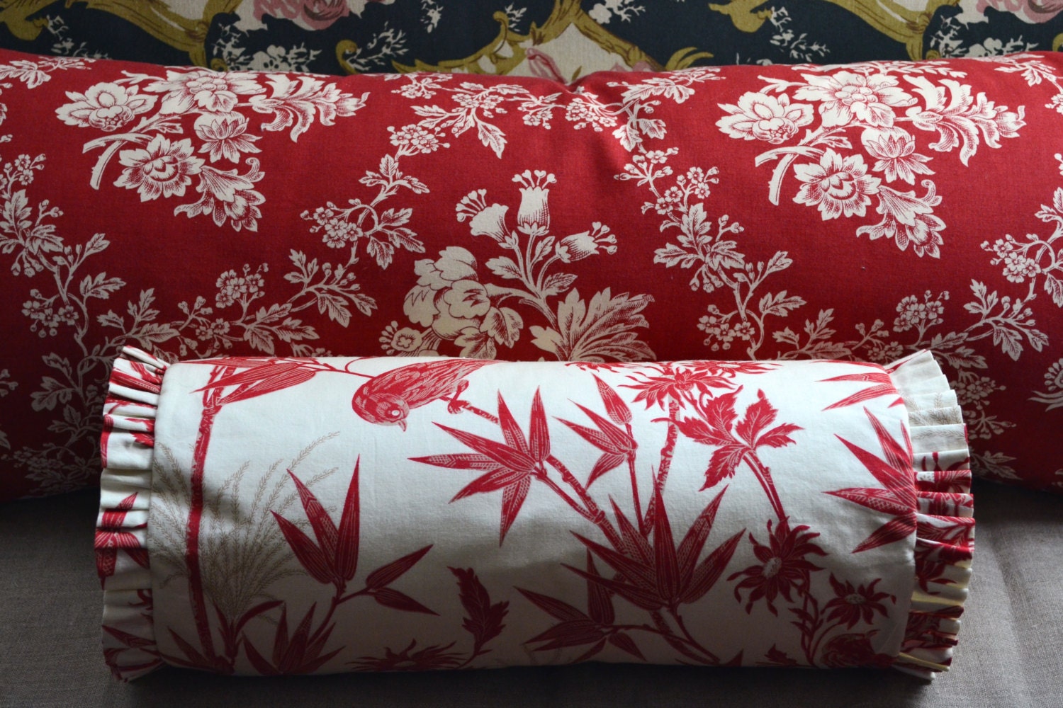 Bolster Pillow in a Beautiful Red Bird Flora and Fauna Print with a Ruffled Edge