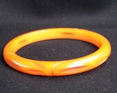 Vintage Bakelite Bangle Pierced and Carved Pumpkin Orange