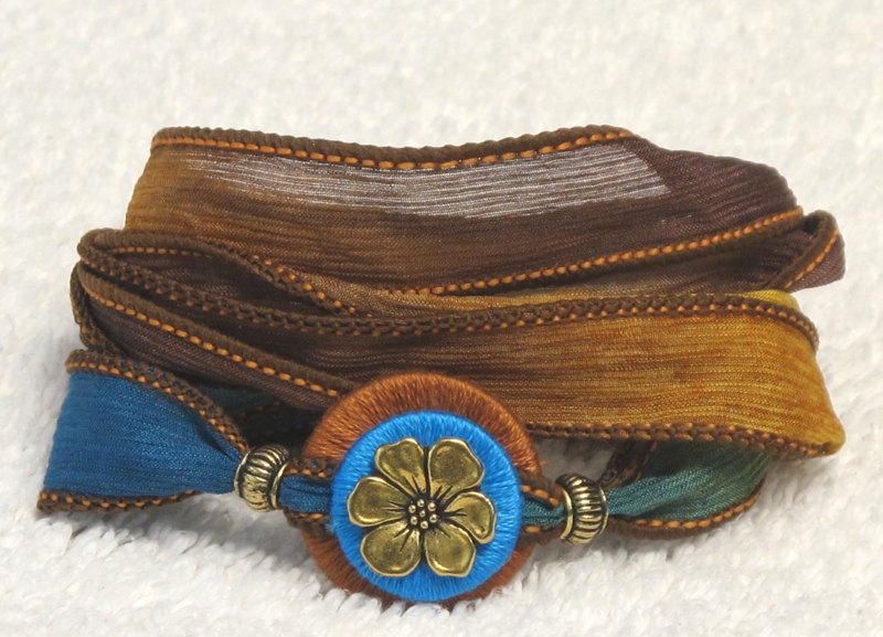 Silk Whirly Wrap Bracelet in earth teal mustard forest with gold plated blossom and secure magnet spring brights