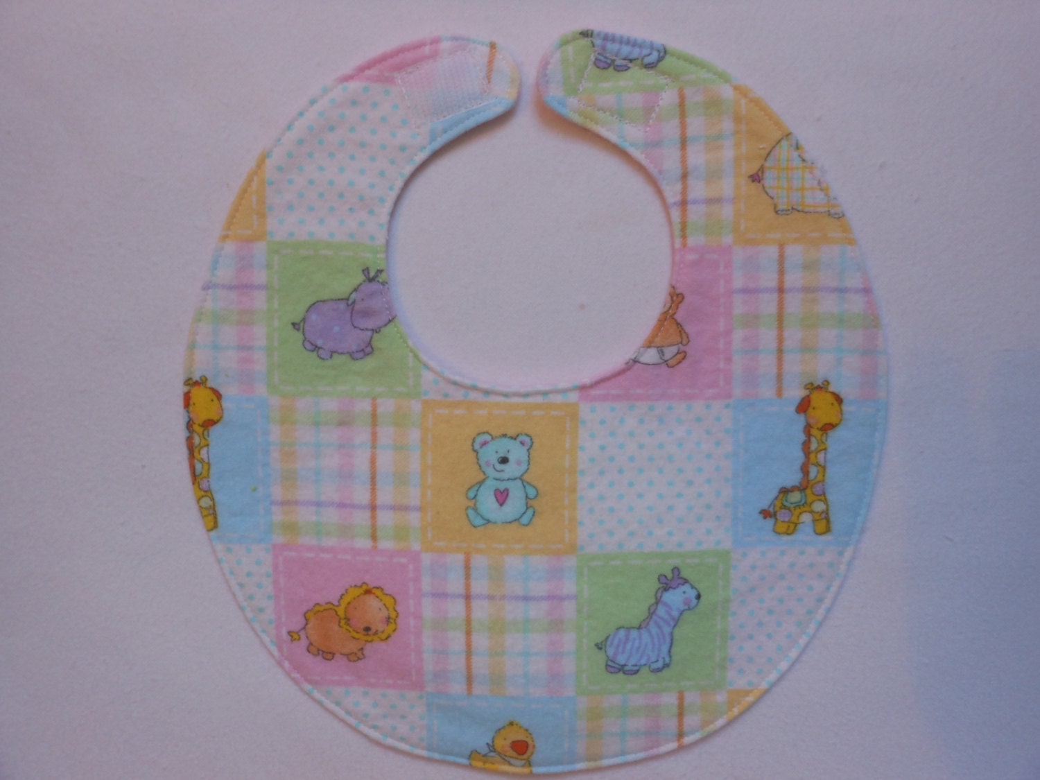 Baby bib, four soft layers, reversible, pink, yellow, & blue baby animals