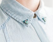 Emerald green collar brooches