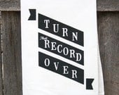Tea Towel "Turn That Record Over" banner print in black ink on white towel