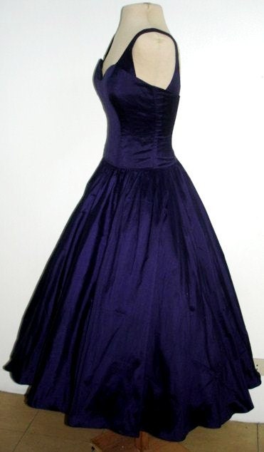 A sexy yet elegant 50s style cocktail dress in gorgeous deep blue satin