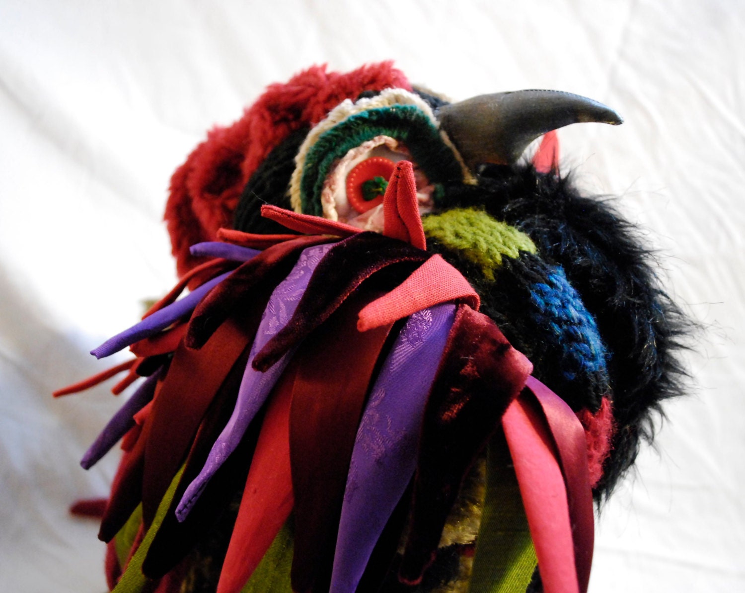 Cassius Alp.  Proud and colorful sculptural bird.  Fiber art, sculpture