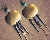jayde.  a pair of jewel toned arrow and spike tribal earrings.