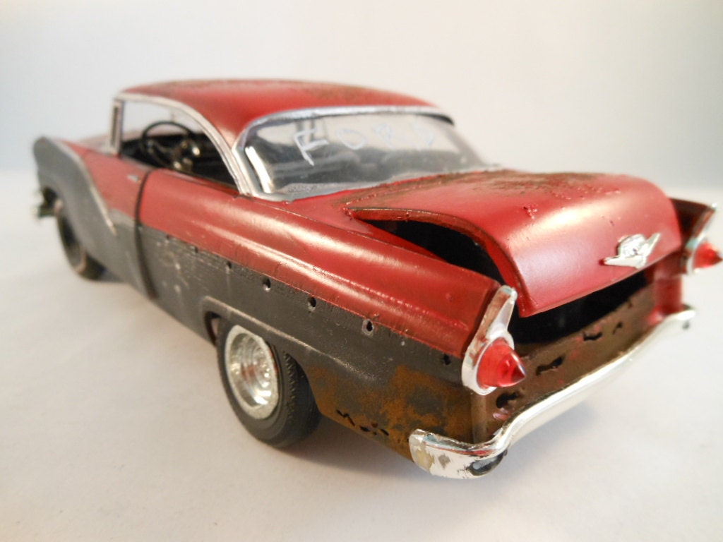 1956 Ford 1/24 scale plastic model car in red and black