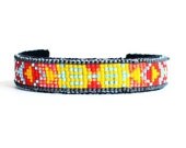 loom woven cuff blue, red, salmon, yellow, gray