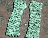 Women's or teenager hand knitted orchard green lacy wrist warmers / fingerless gloves.