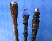 Dollhouse miniature Wizard's Magic Staff in deepest black with a pale purple crystal