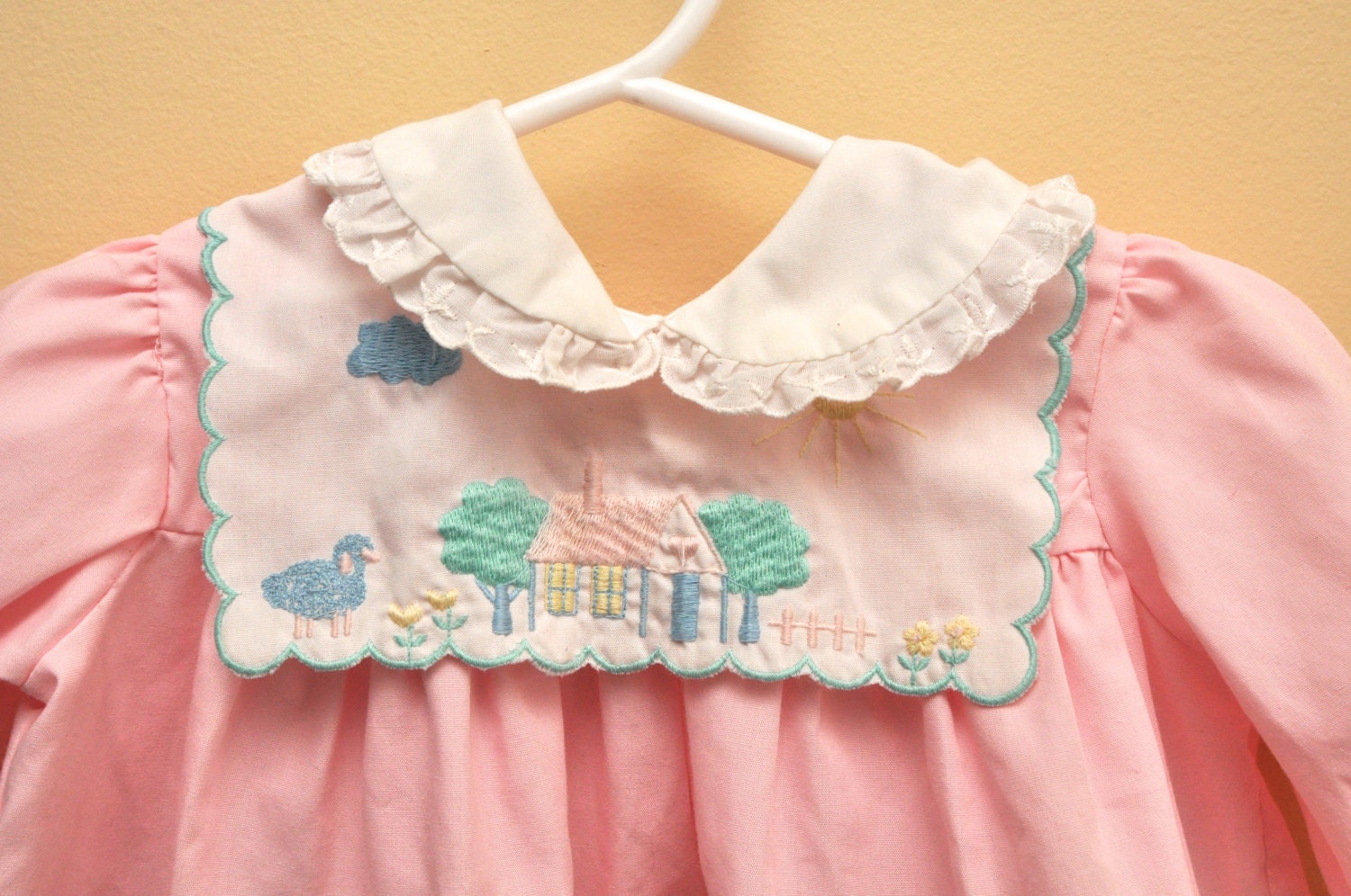 SALE vtg pink baby dress, with bib collar, featuring embroidered farm house and sheep, 6-12 months