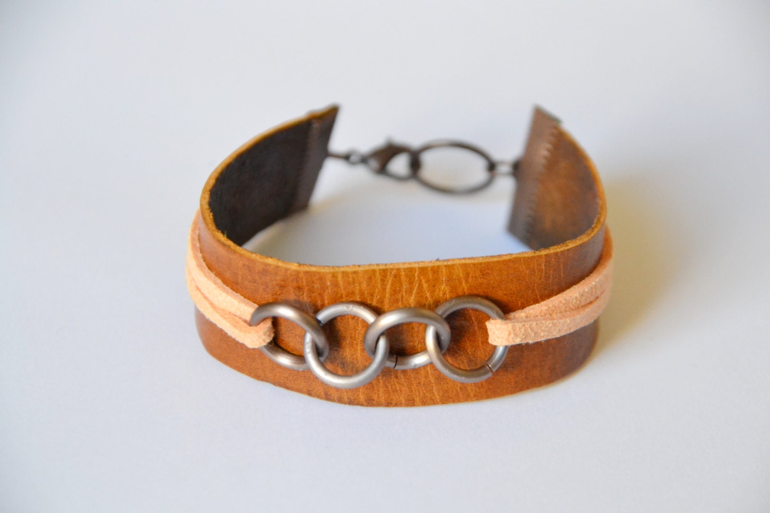 Leather and suede cuff. Hand cut tan leather with peach suede. Small size.