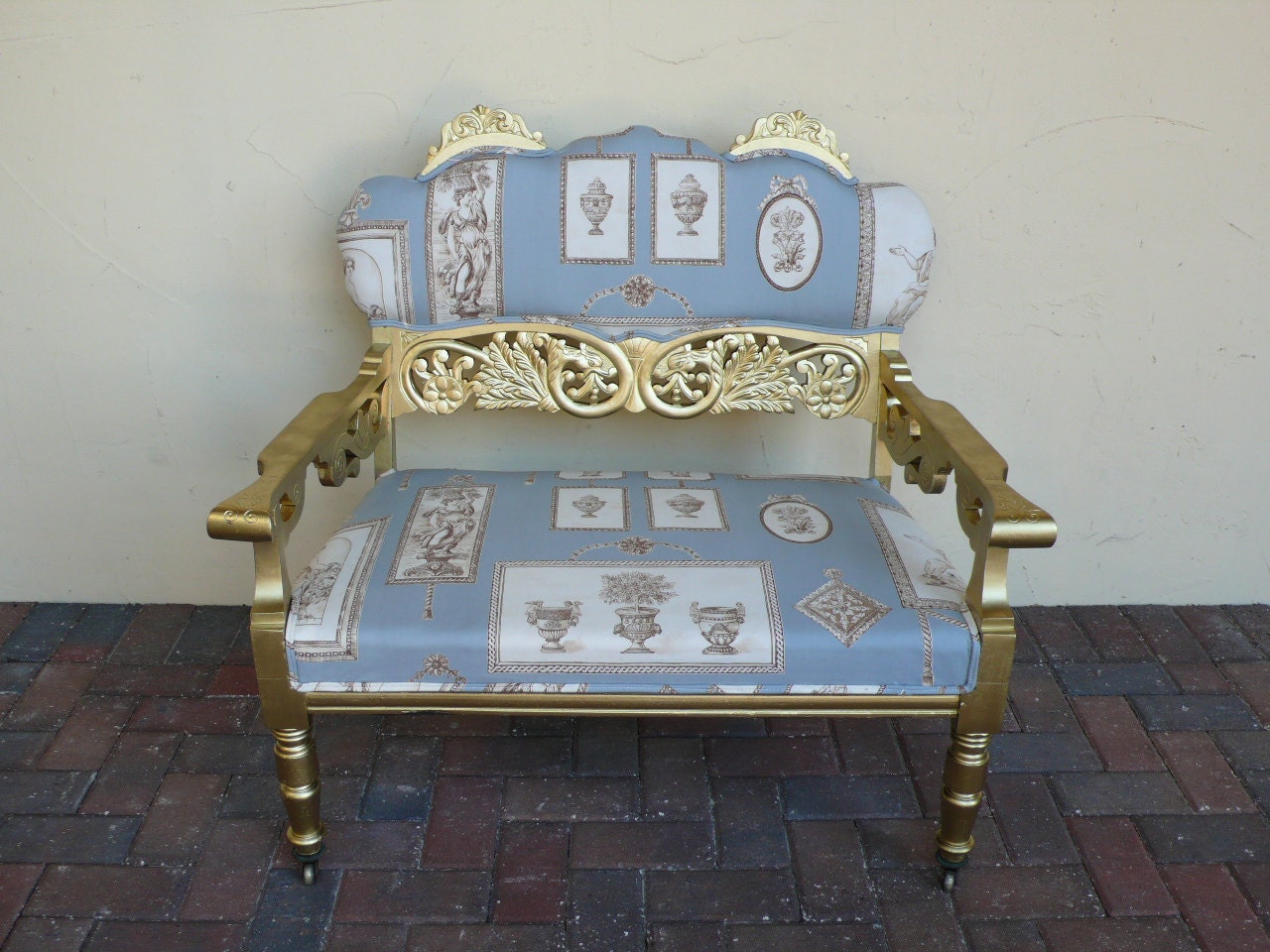 Antique gold finish wood love seat chair with blue / gold Roman fabric